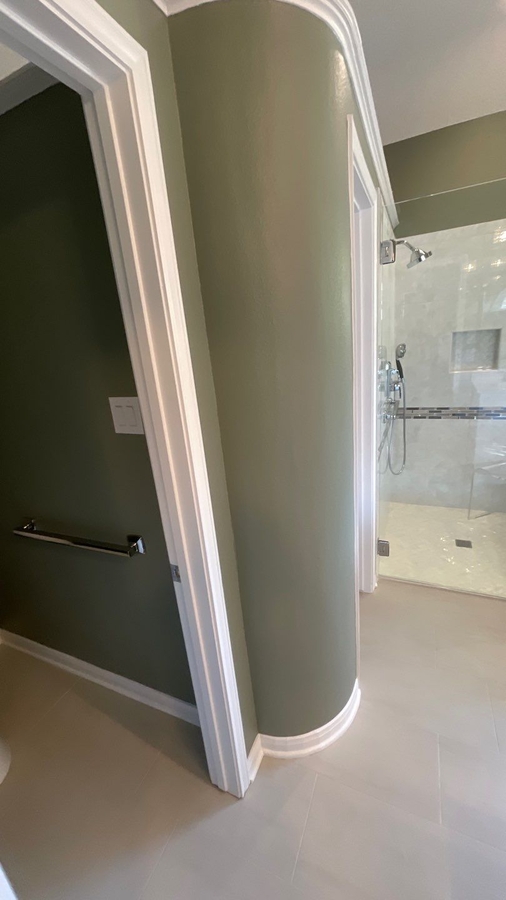 Compact toilet area remodel with clean lines by Wade Caldwell Construction i