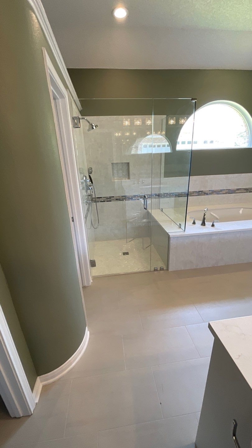 San Antonio bathroom remodel featuring walk-in glass shower and tile surroun