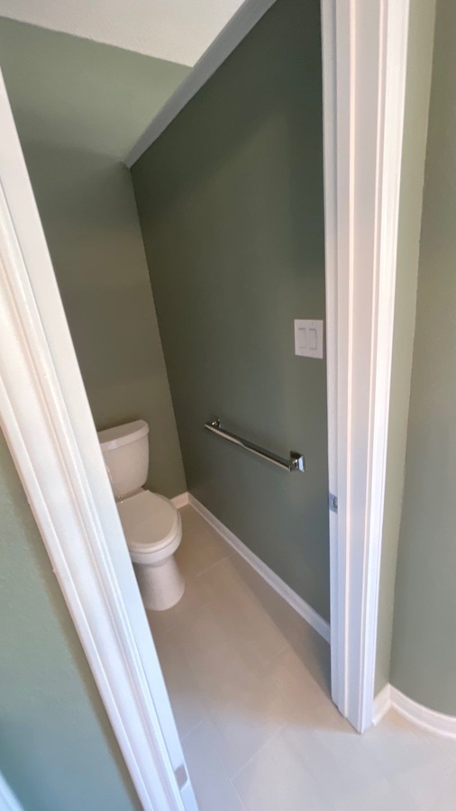 Walk-in closet entrance in master bathroom remodel by Wade Caldwell Construc