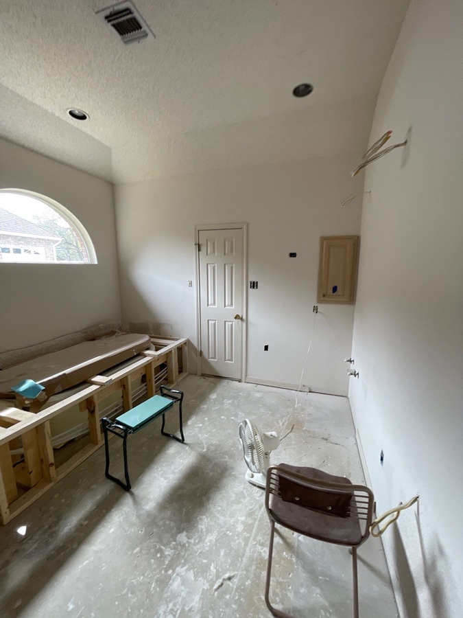 Mid-stage San Antonio bathroom remodel with tub framing and vanity wall pre