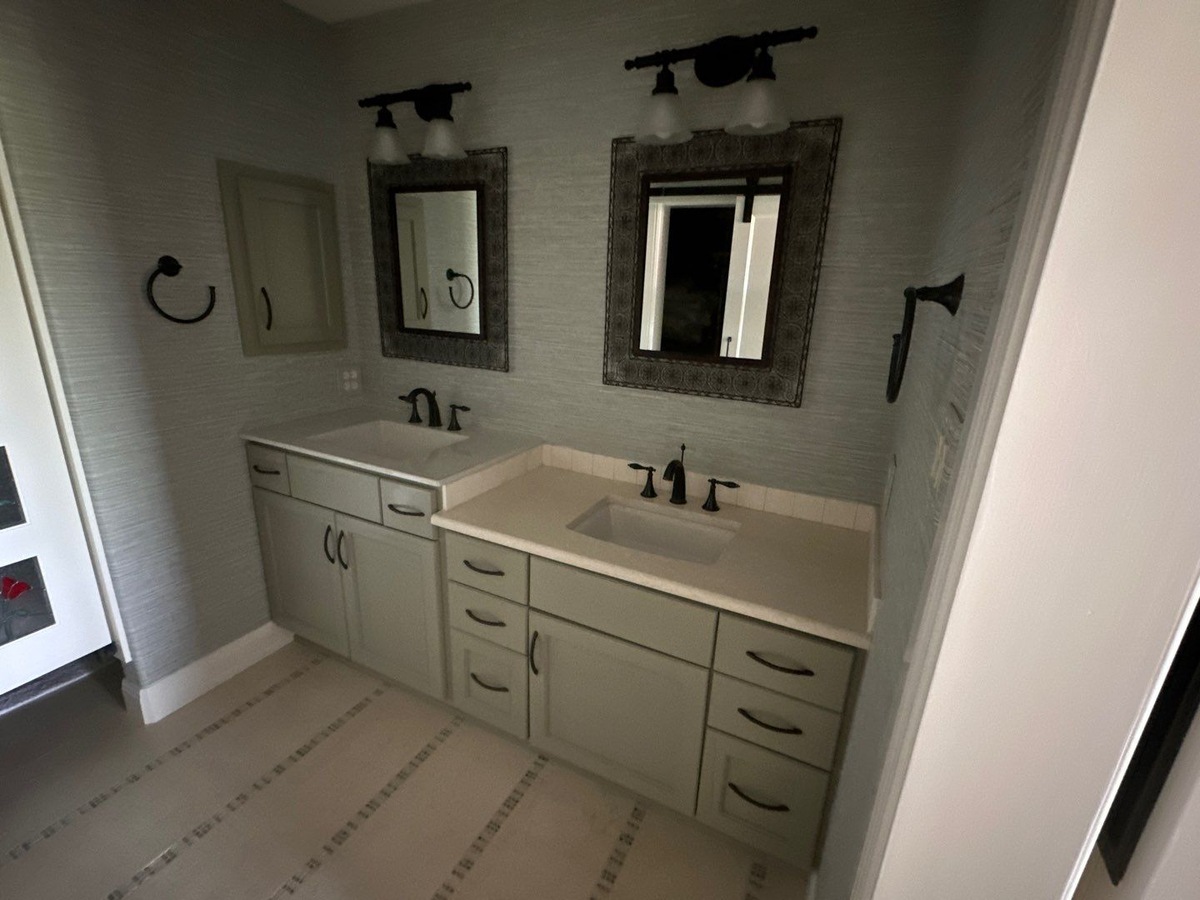 Modern bathroom in San Antonio featuring twin sinks and l