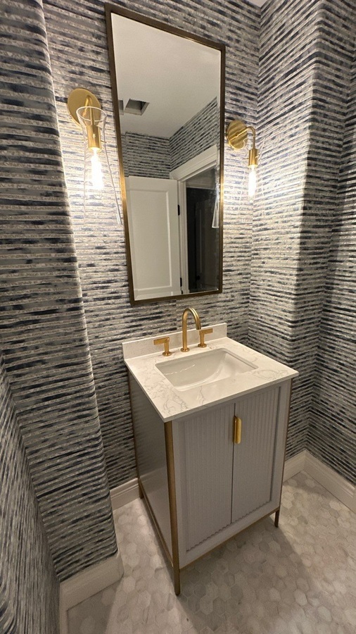 Refined half-bath remodel with vertical wall tile and mod