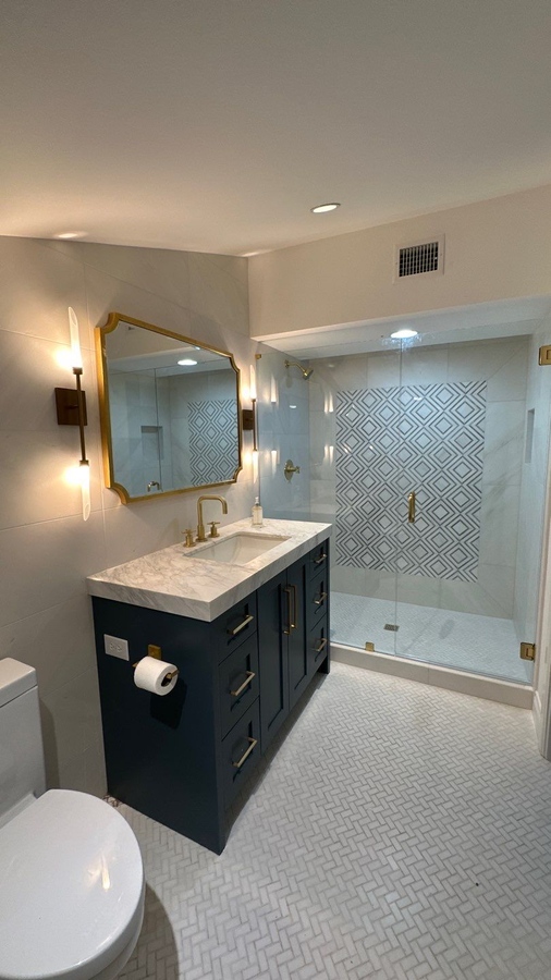 Upscale bathroom renovation with glass shower and modern 