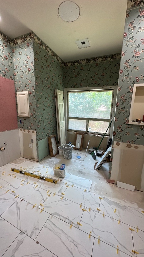 Ongoing bathroom remodel with wall prep and debris in Alamo Heights by Wade Caldwell Cons