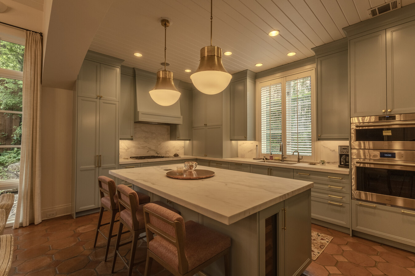 Evening kitchen lighting shows off elegant remodel by Wade Caldwell Construction in Alamo Heights,