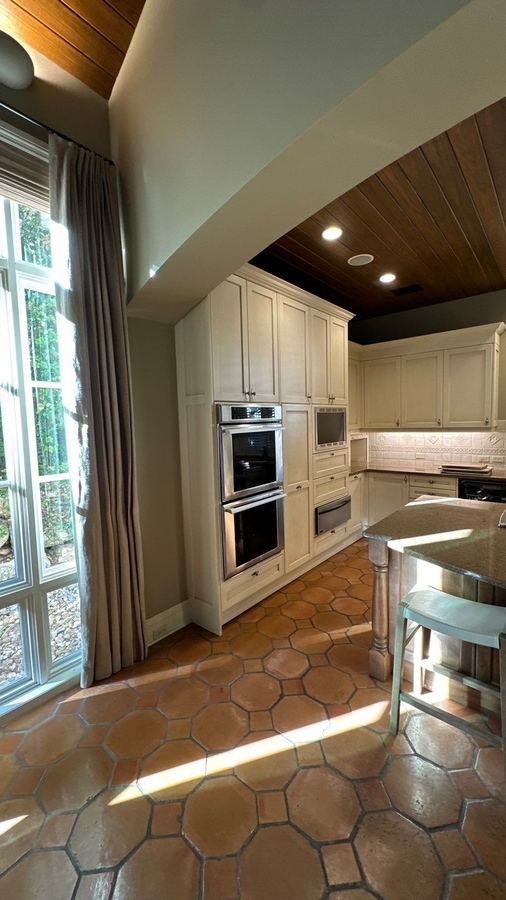 Bright kitchen transformation with built-in appliances and curved island in Hollywood Park, TX