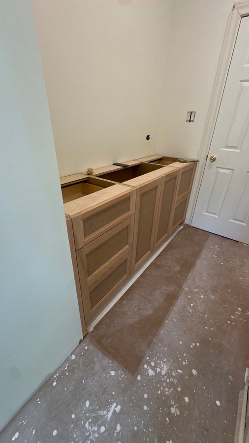Partial bathroom renovation showing custom double vanity installation in San Antonio b