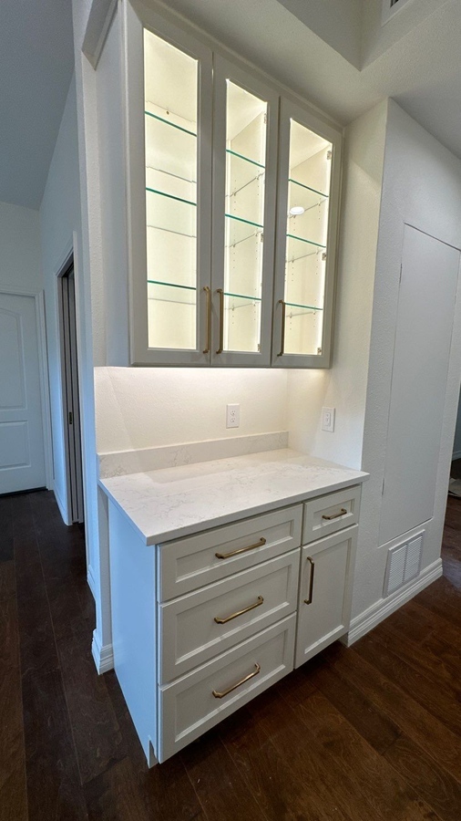 Shavano Park kitchen remodel featuring display cabinetry and brass handles by Wade Caldwell Con