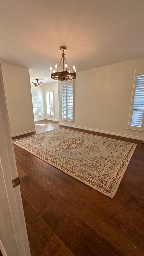 Whole house update in San Antonio featuring clean walls, wide plank floors, and elegant ceiling
