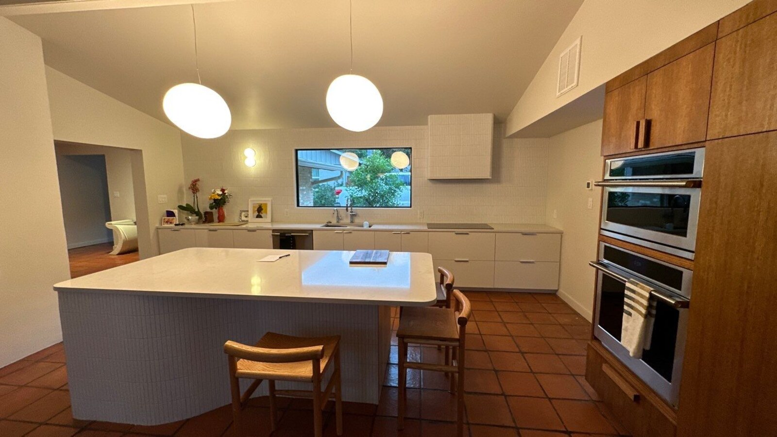 Updated kitchen featuring natural wood finishes and built-in ovens in Shavano Park, TX