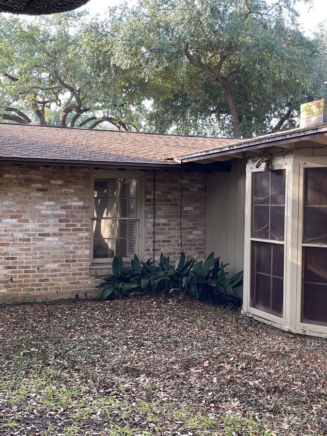 Aged brick and siding corner exterior in need of remodeling in San Antonio, TX by Wad