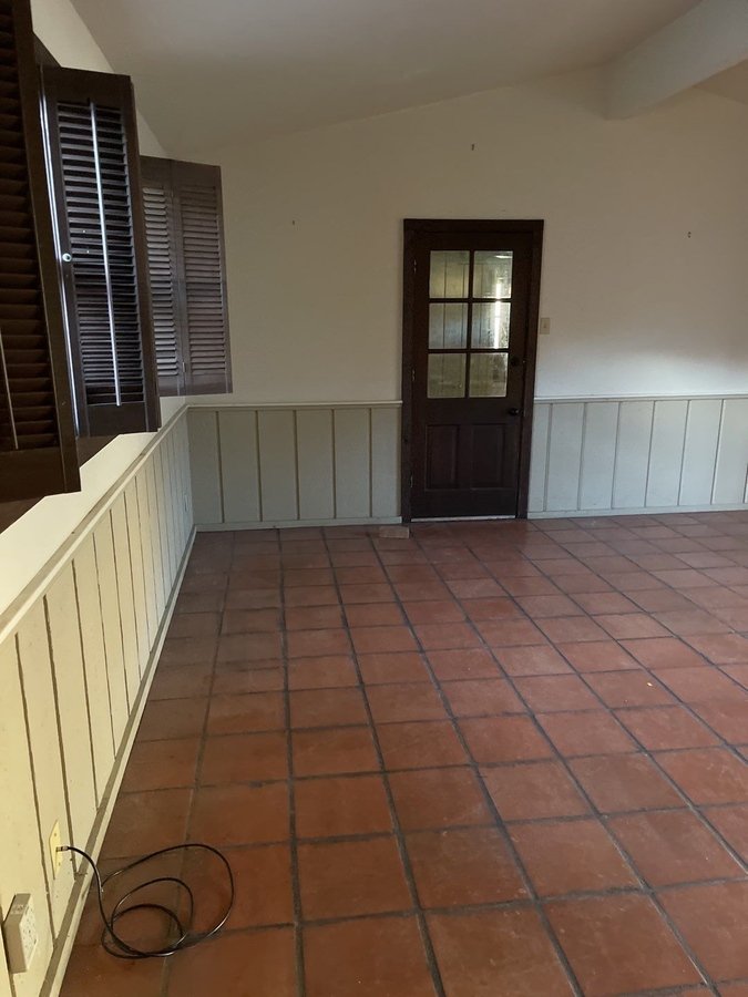 Wainscoted interior space before remodeling in San Antonio, TX by Wade Caldwell Const